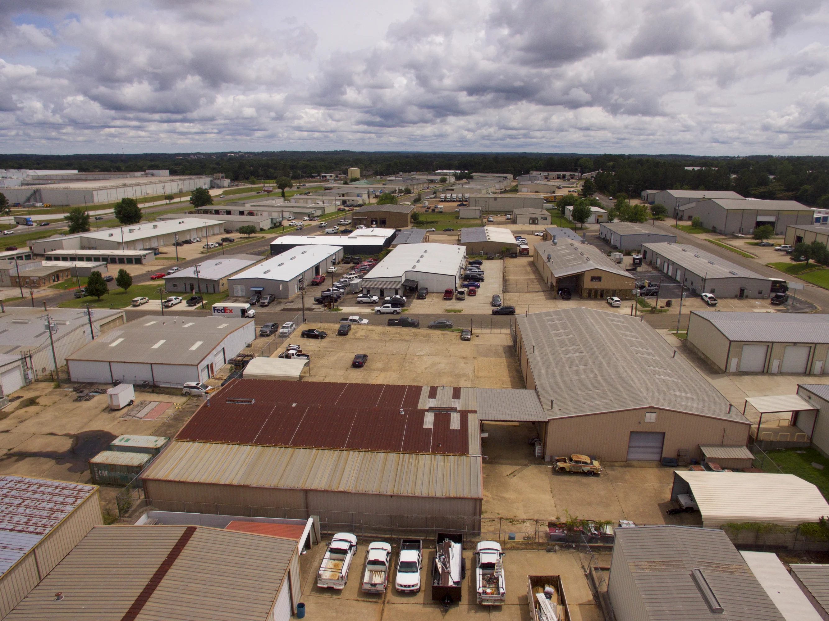 Industrial loading and drive-in access area within the fenced Candy Park site on Broussard Street.