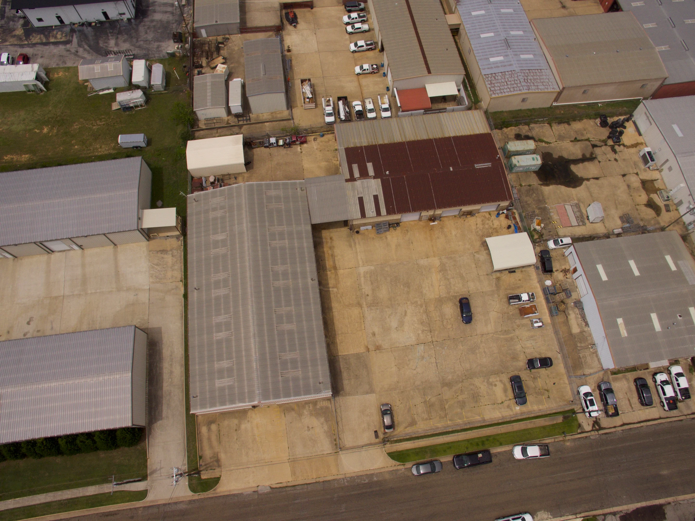 Site view showing both Candy Park industrial buildings, paved yard, and operational circulation area.