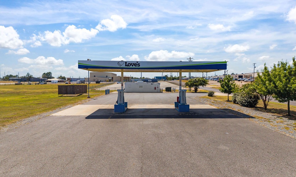 Love's natural-gas fueling station canopy with dual dispensers on a paved lot.