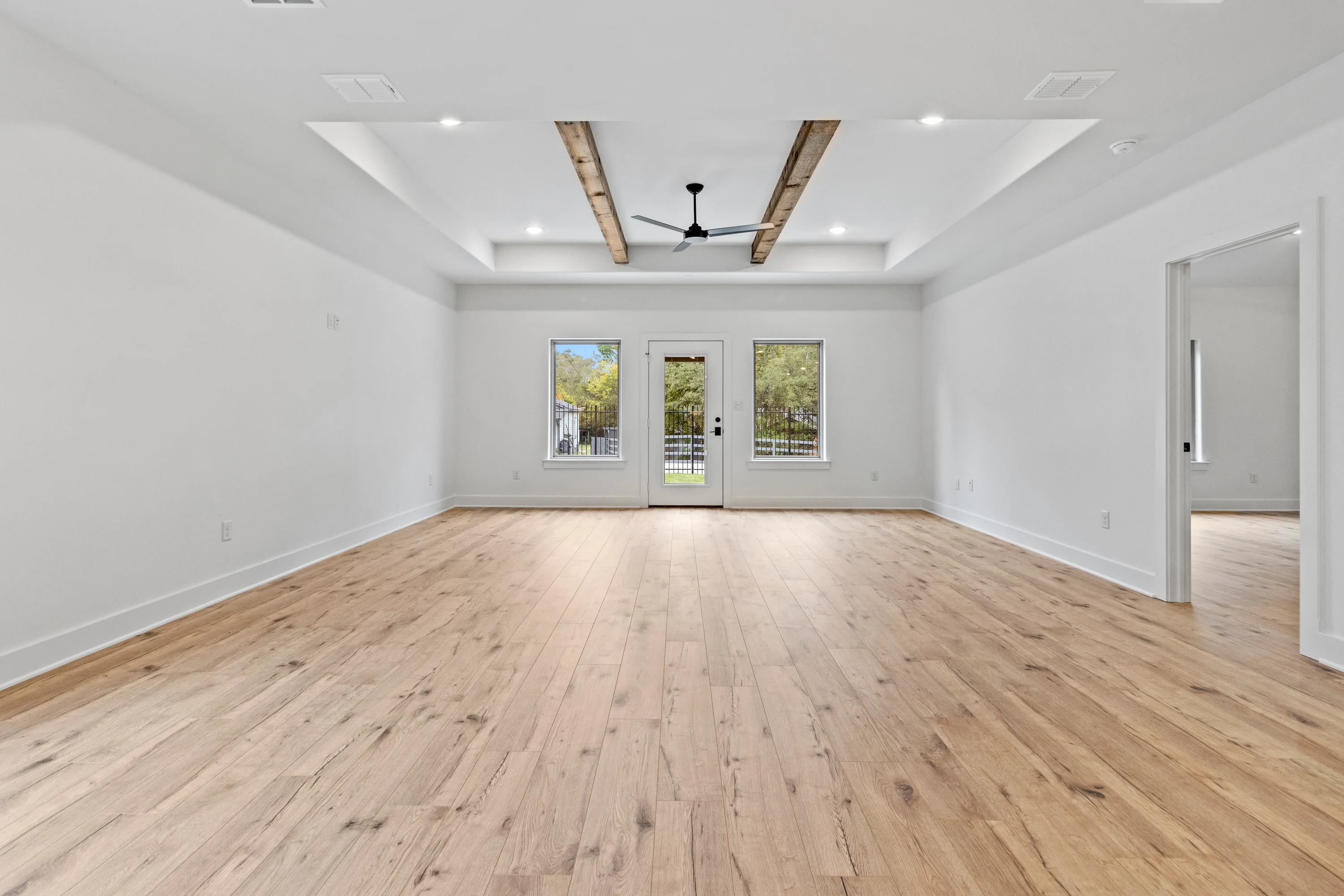 Primary bedroom inside a three-bedroom residence at Henshaw Creek Duplex Community.