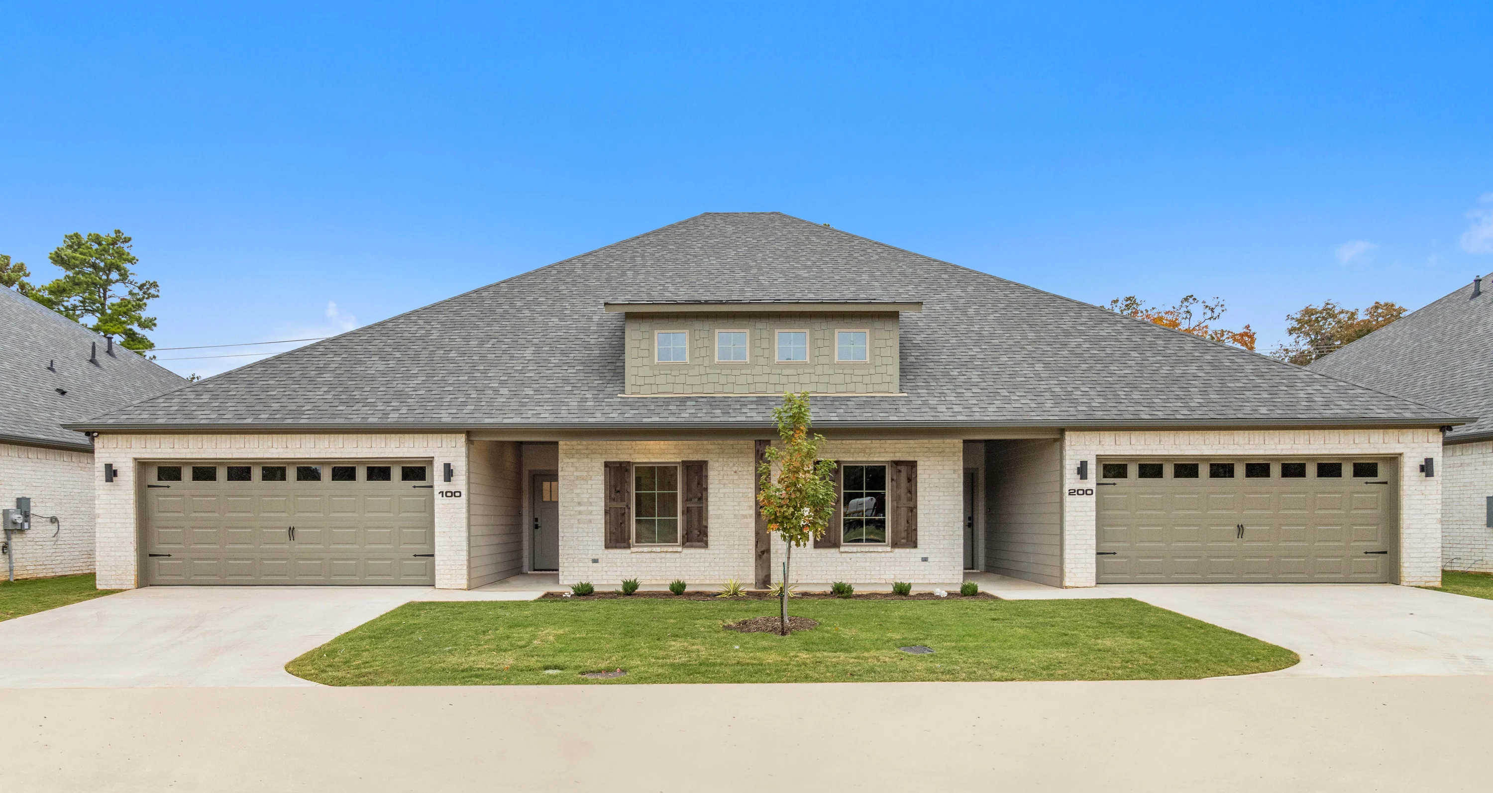 Open-concept living and kitchen area inside a three-bedroom Henshaw Creek duplex residence.