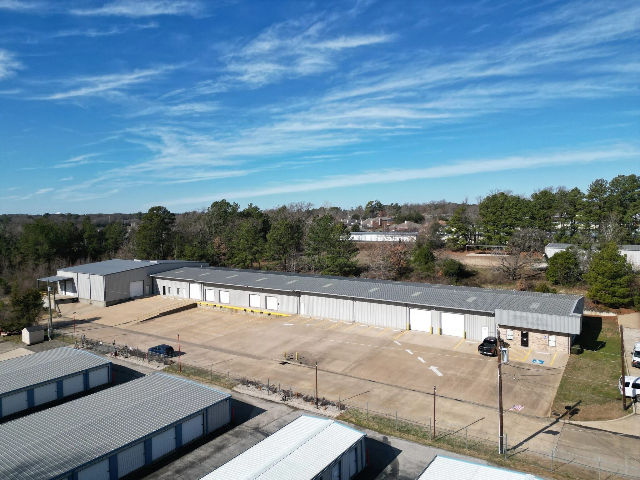 Aerial view of the single-tenant industrial building, dock ramp, and parking lot at Highway 110 Industrial in Tyler, Texas.