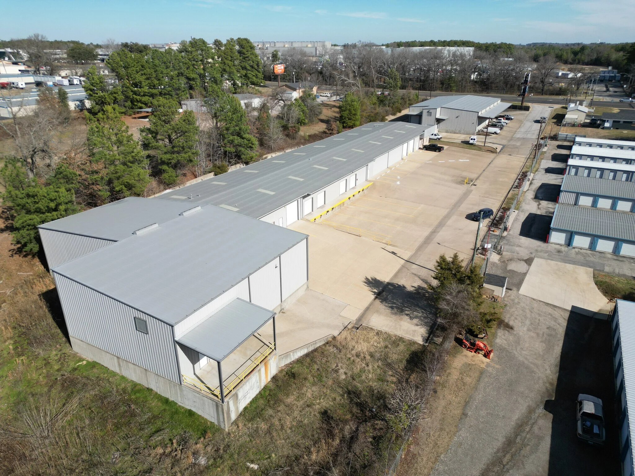 Aerial view down the length of the metal building and its dock-side truck court at Highway 110 Industrial in Tyler, Texas.