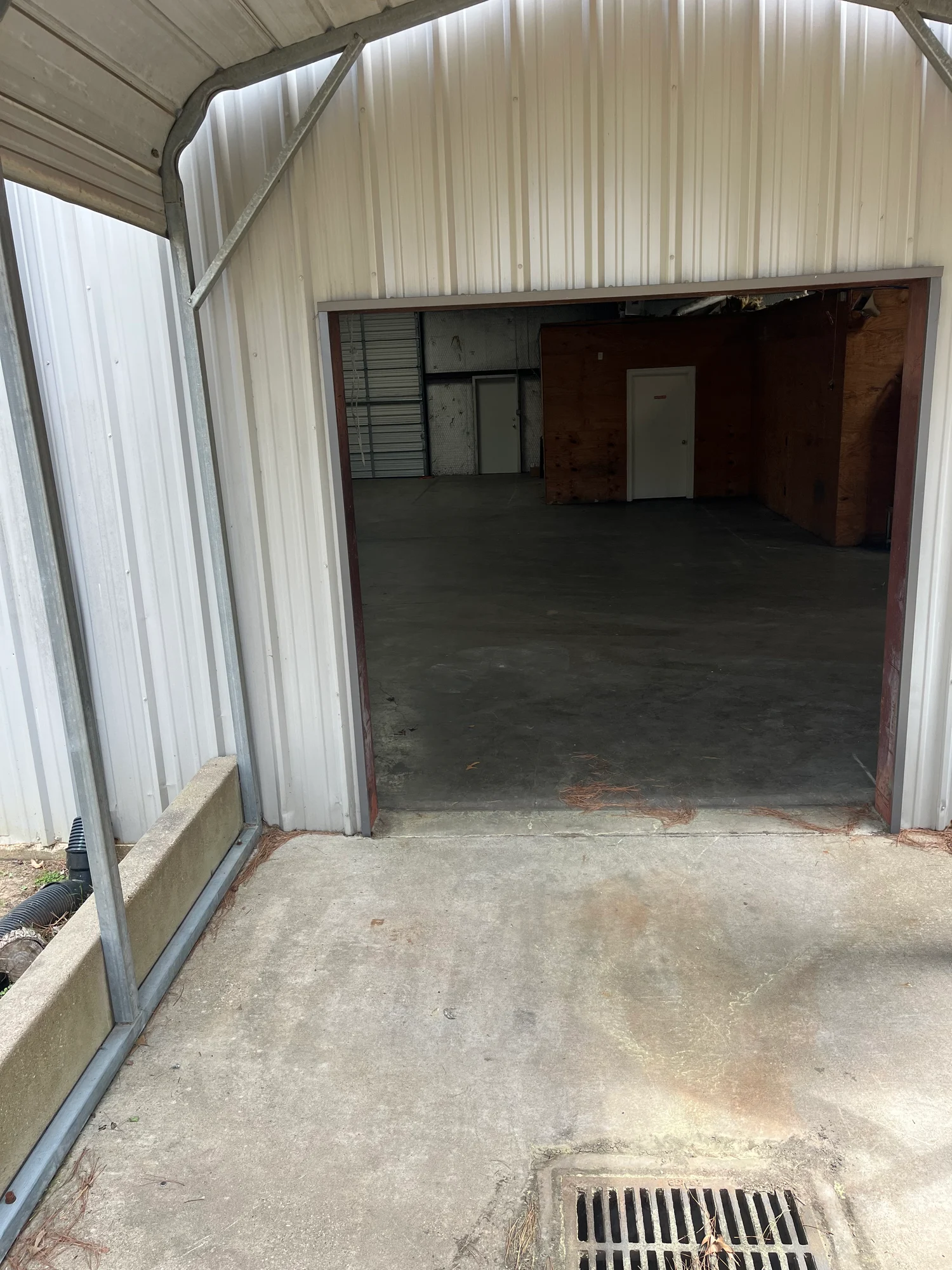 Exterior drive-in bay opening looking into the warehouse interior at Highway 110 Industrial in Tyler, Texas.