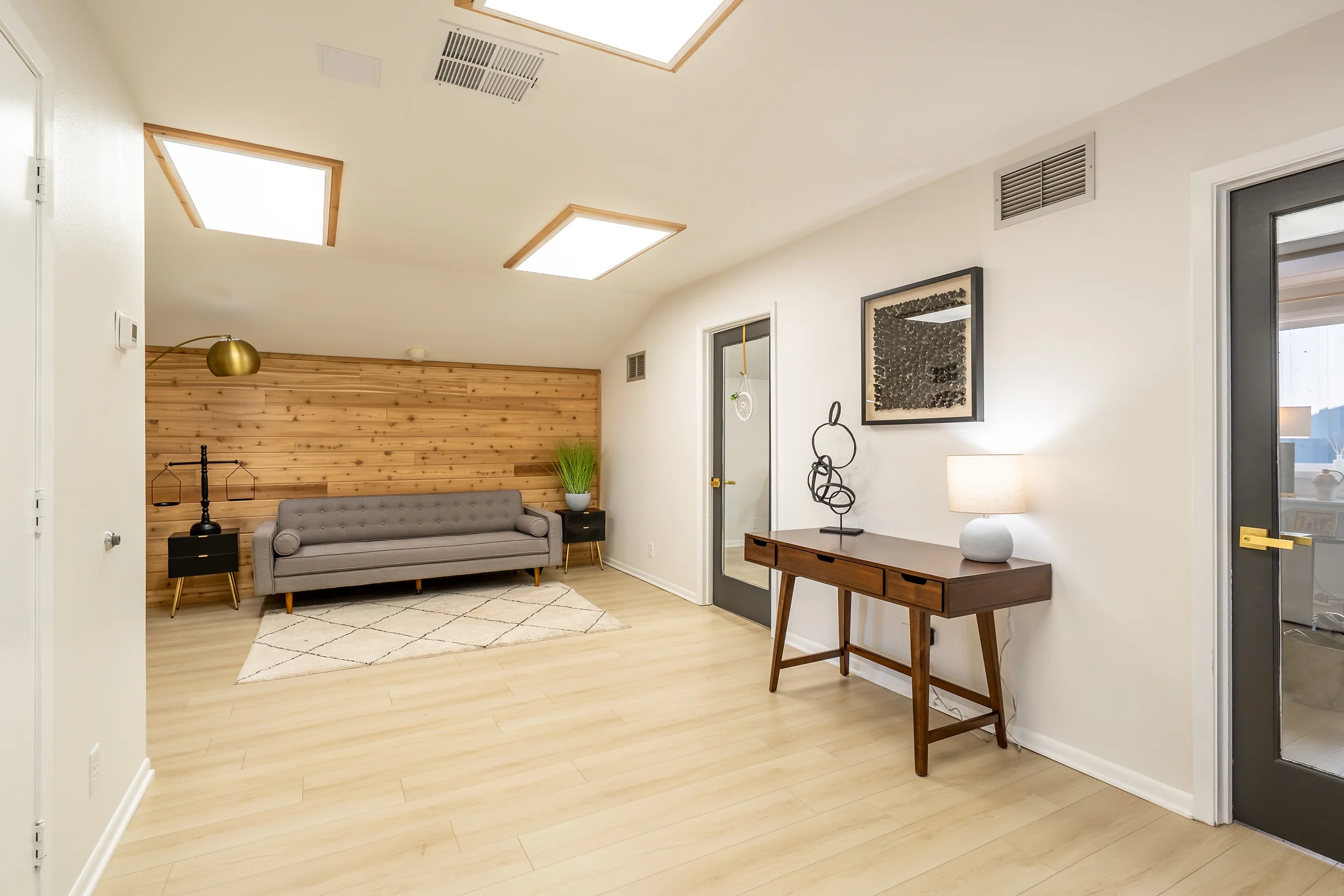 Interior hallway connecting private offices and work areas at the Loop 323 office property.