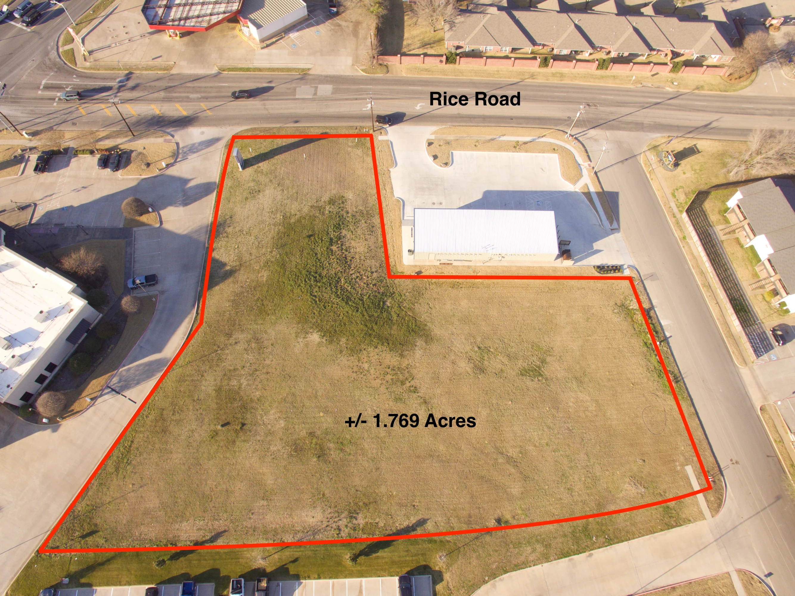 Aerial view outlining the 1.769-acre commercial development tract at Old Jacksonville Highway and Rice Road in Tyler.