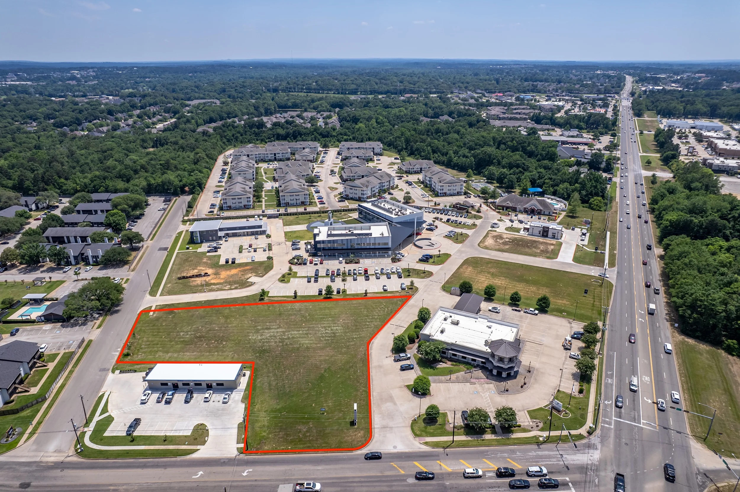 Aerial angle showing the site's dual access from Old Jacksonville Highway and Rice Road in South Tyler.