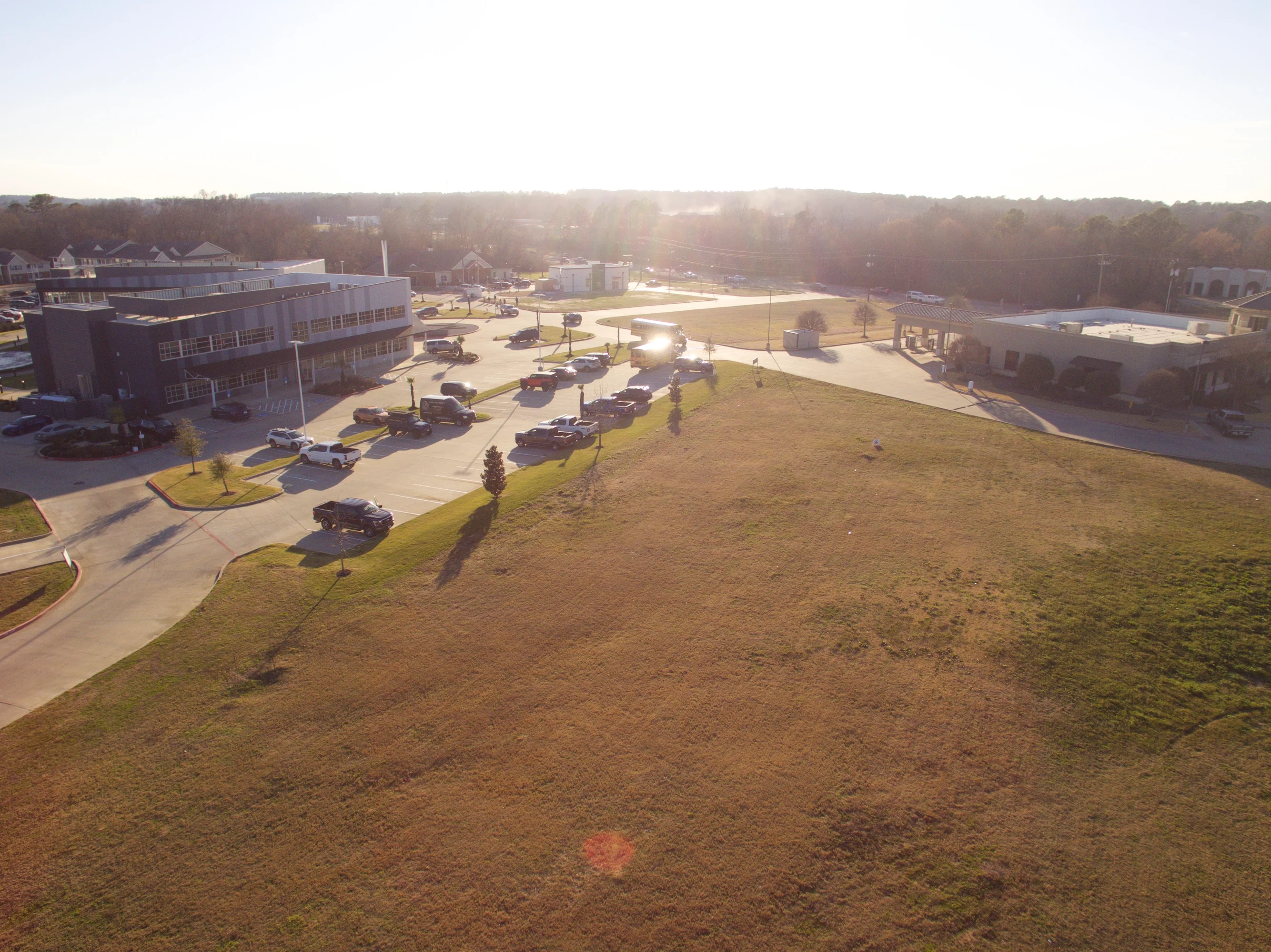 Closer aerial view of the commercial land, roadway frontage, and site circulation opportunities at Old Jacksonville Highway and Rice Road.