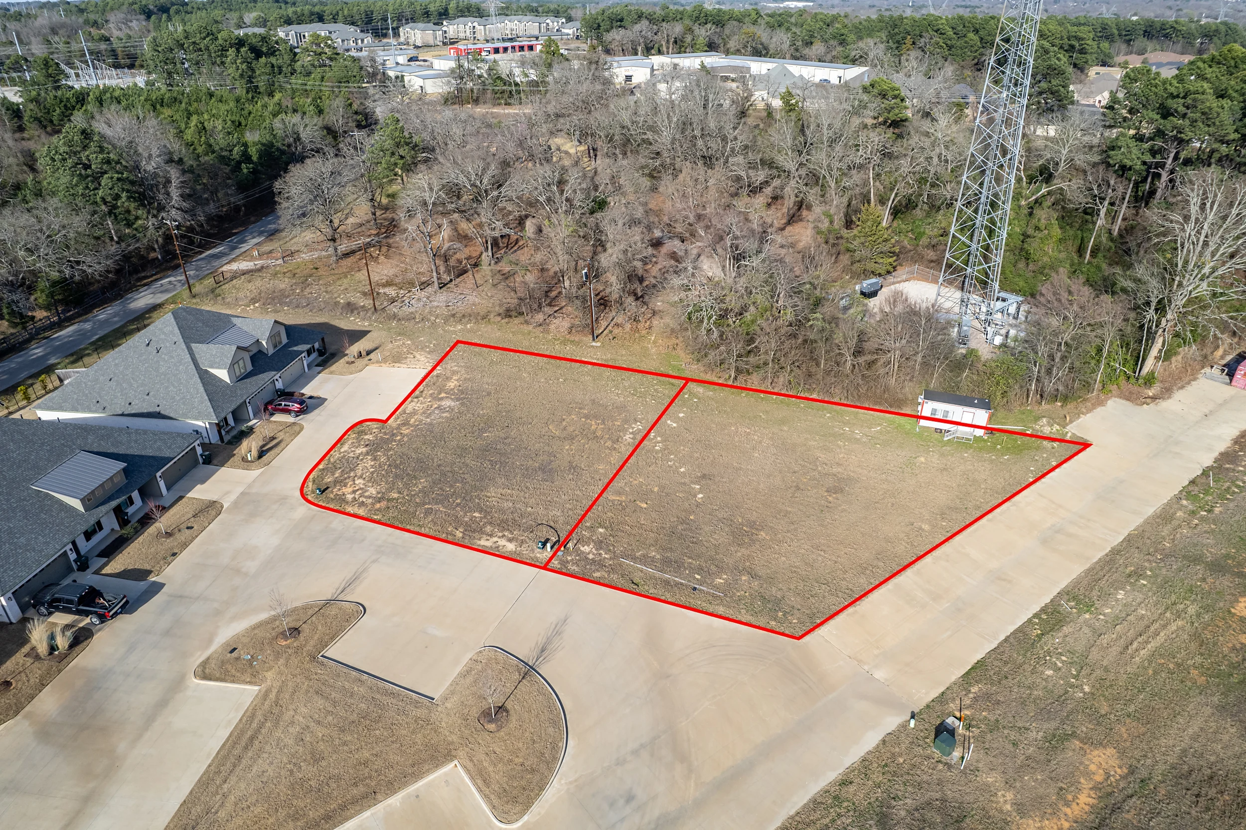 Aerial view of the pad-ready lots showing completed clearing and site preparation in Henshaw Creek.