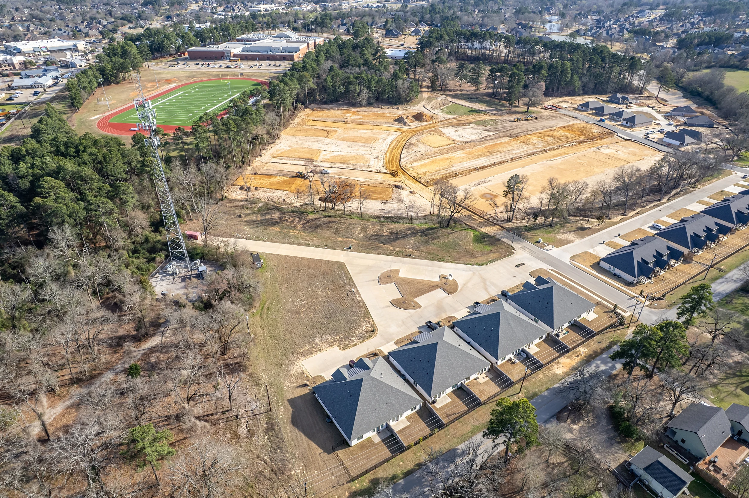 Aerial site view showing street access and utility-ready development frontage along Lazy Vale Court.