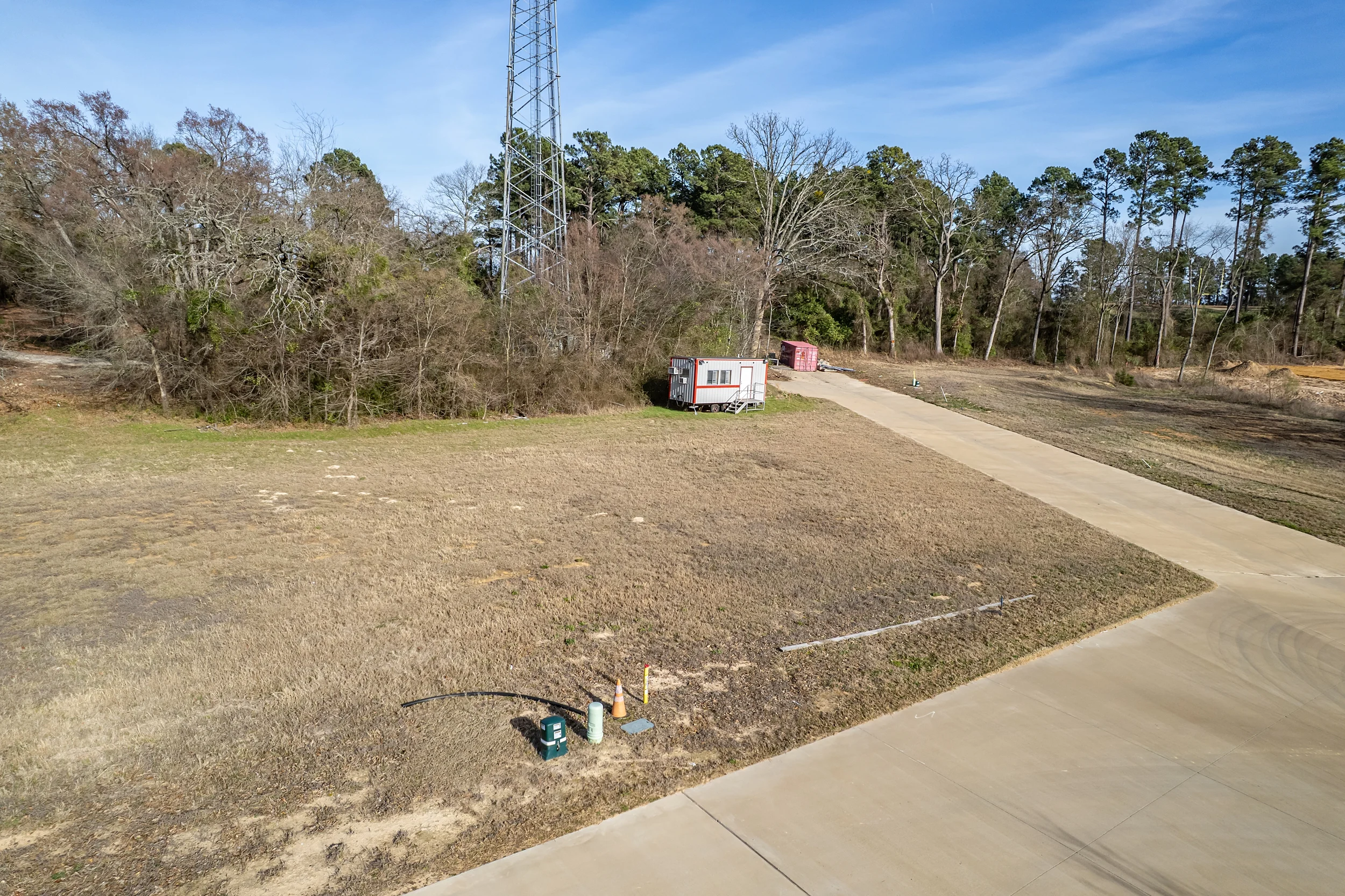 Wide aerial view of the Henshaw Creek area surrounding the seven-lot duplex development site.