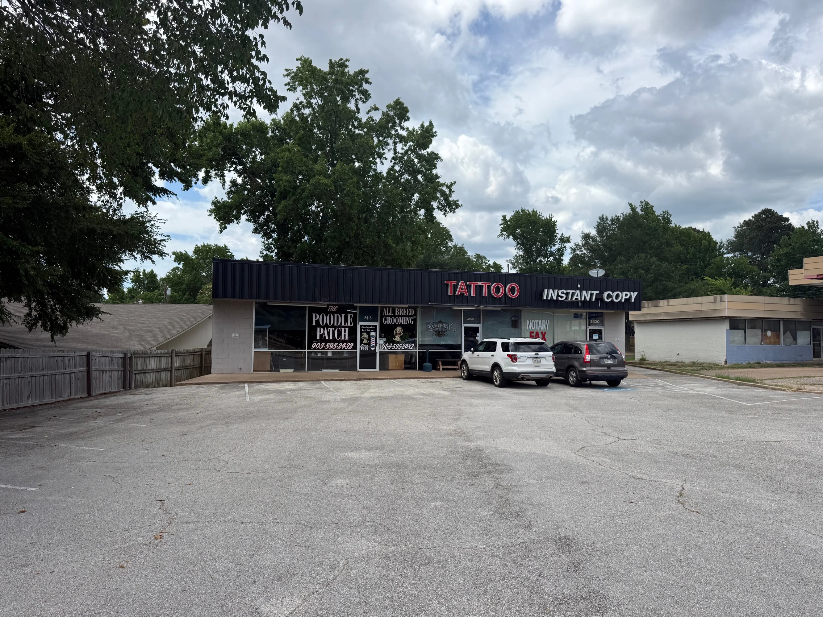 Wide storefront view of the three-tenant retail center at 2416 E. Southeast Loop 323 in Tyler, Texas.