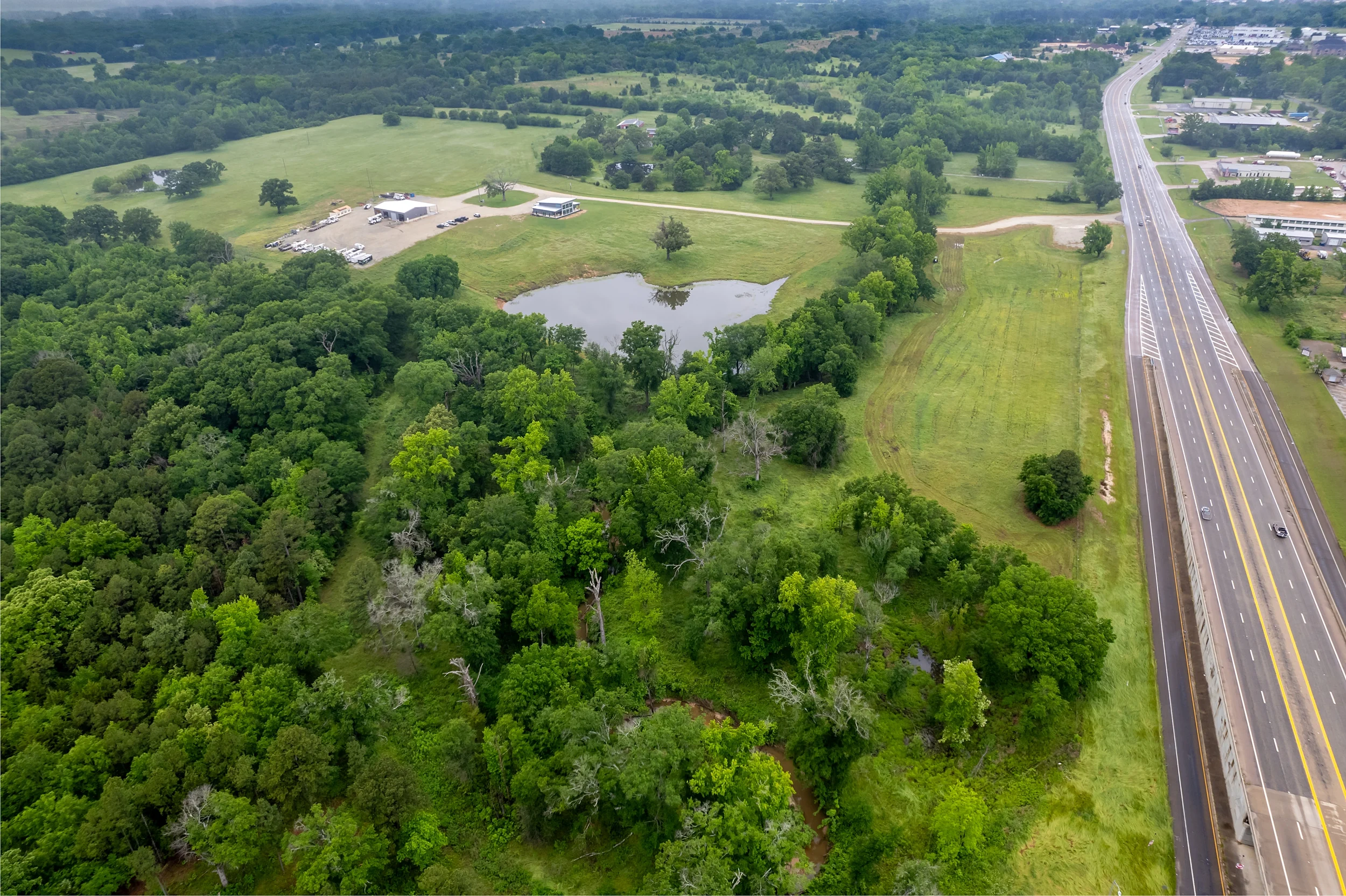 Aerial parcel view illustrating flexible commercial pad-site configurations along US-69 near Mineola.