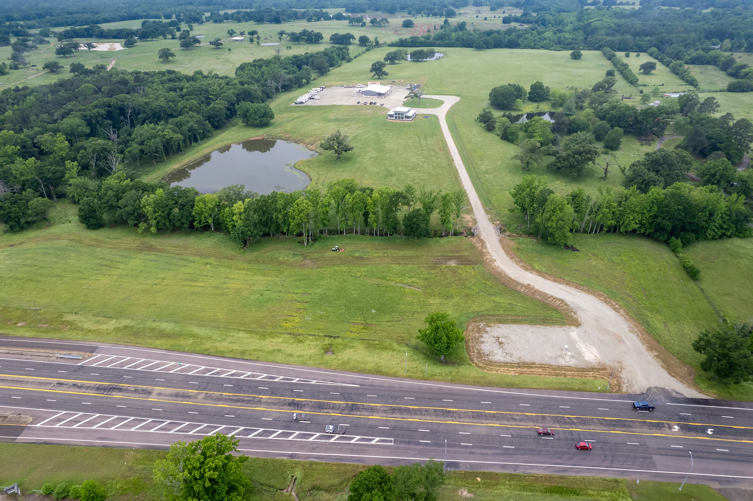 Aerial view across a larger tract within the 1- to 15-acre US-69 development offering.